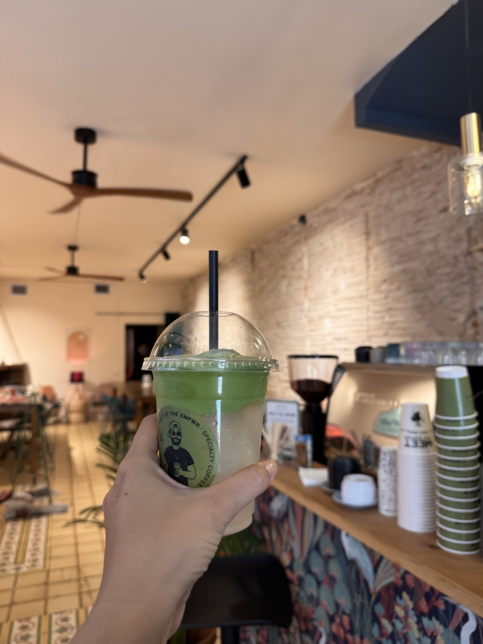 Iced ceremonial matcha at the coffee bar of The EMPWR in Sitges
