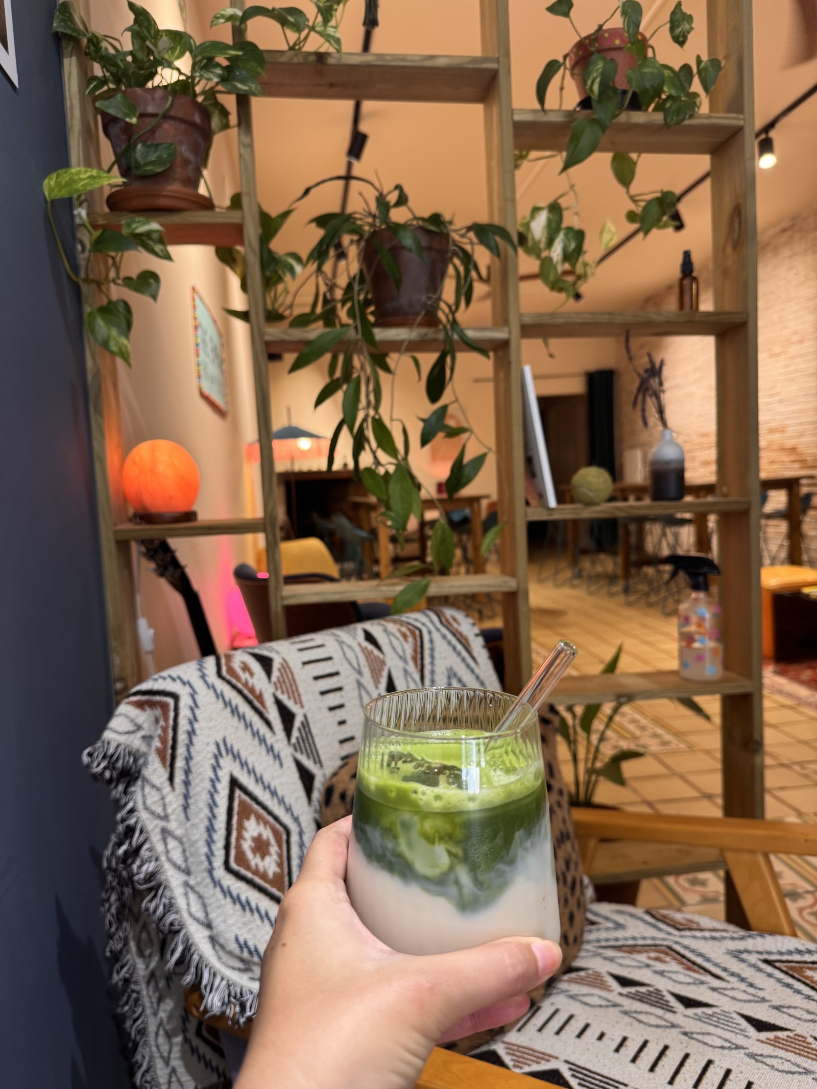 Iced matcha in a cosy corner of The EMPWR cafe a minute from the hotel in Sitges