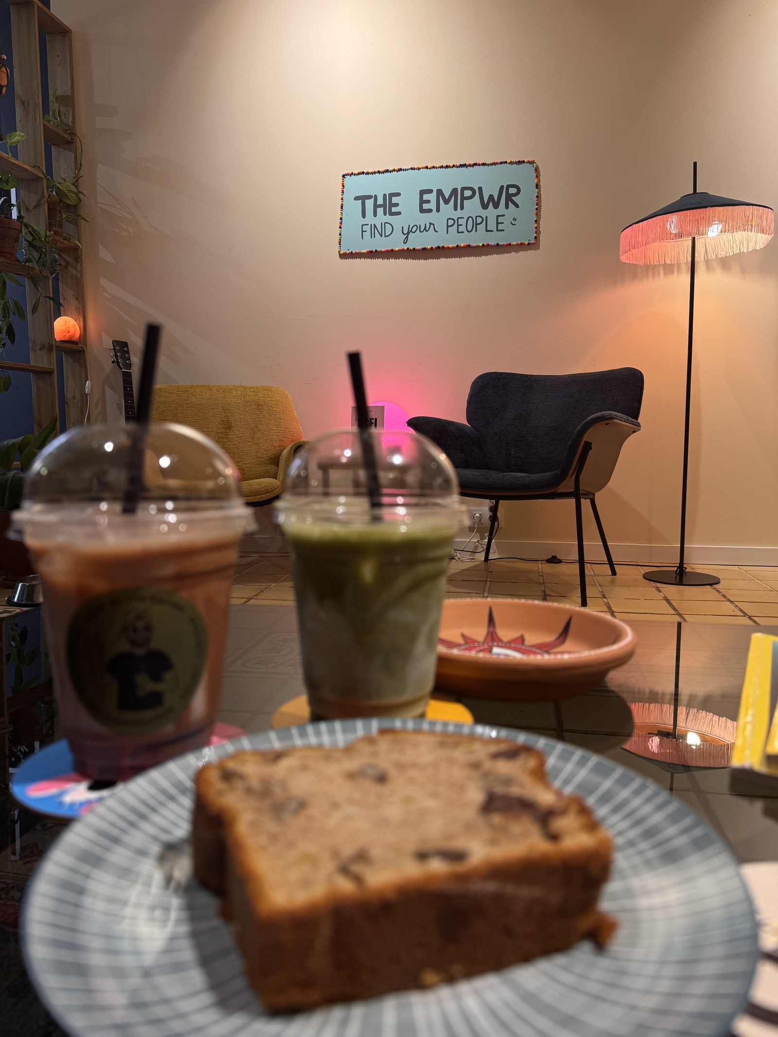 Two adaptogenic iced drinks and a slice of cake at The EMPWR coworking cafe in Sitges