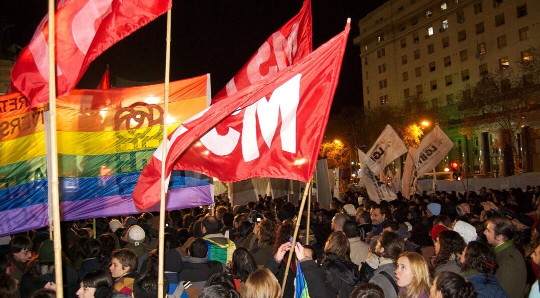 Crowd and rainbow flags in the streets of Sitges during Gay Pride